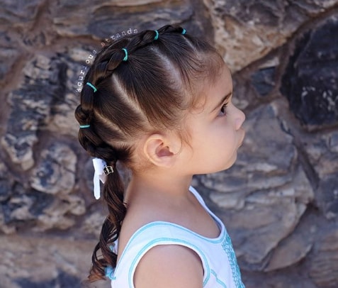 Center Parted Hairstyle With Unique Braided Ponytail